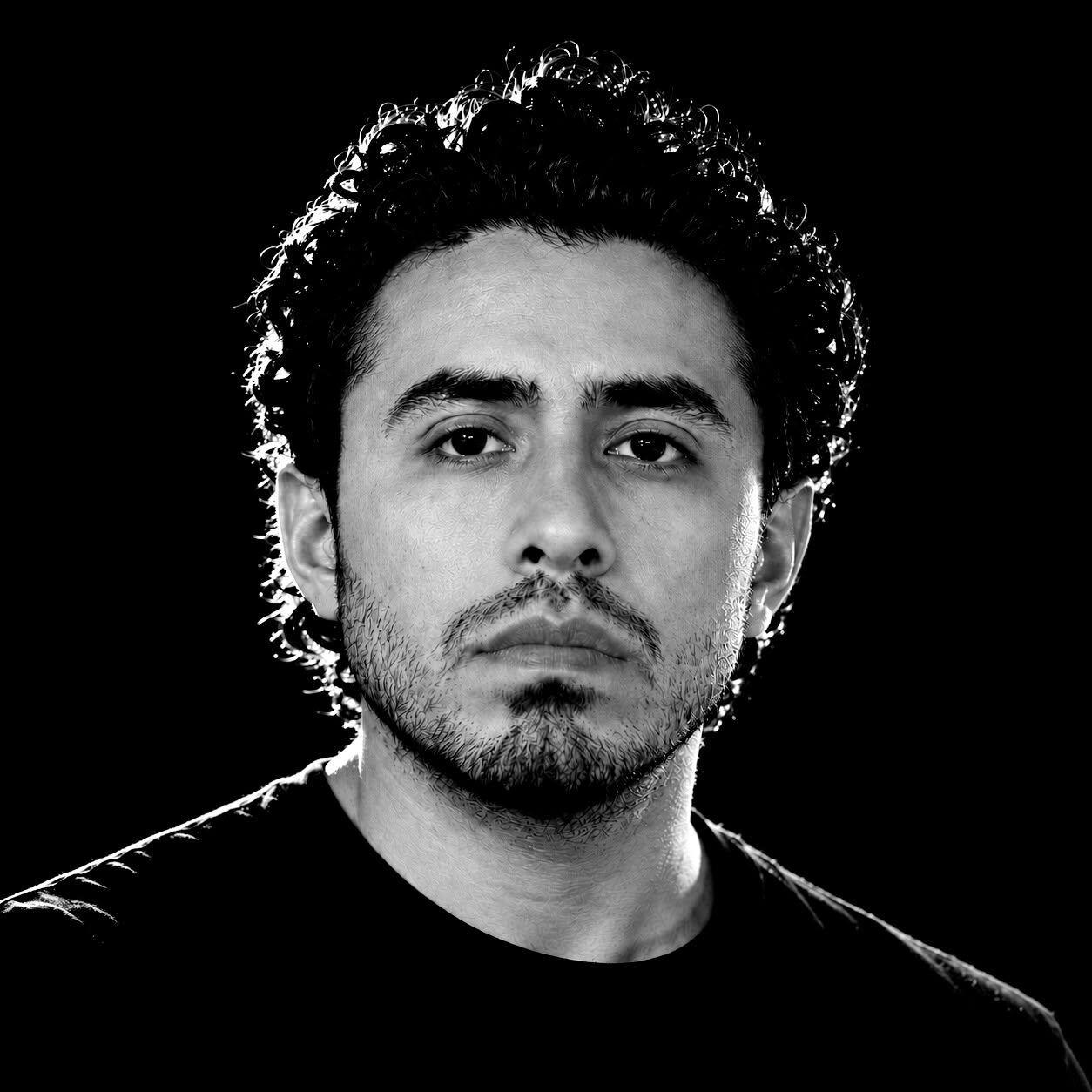 Black-and-white portrait of the Espartanos Fight Club coach